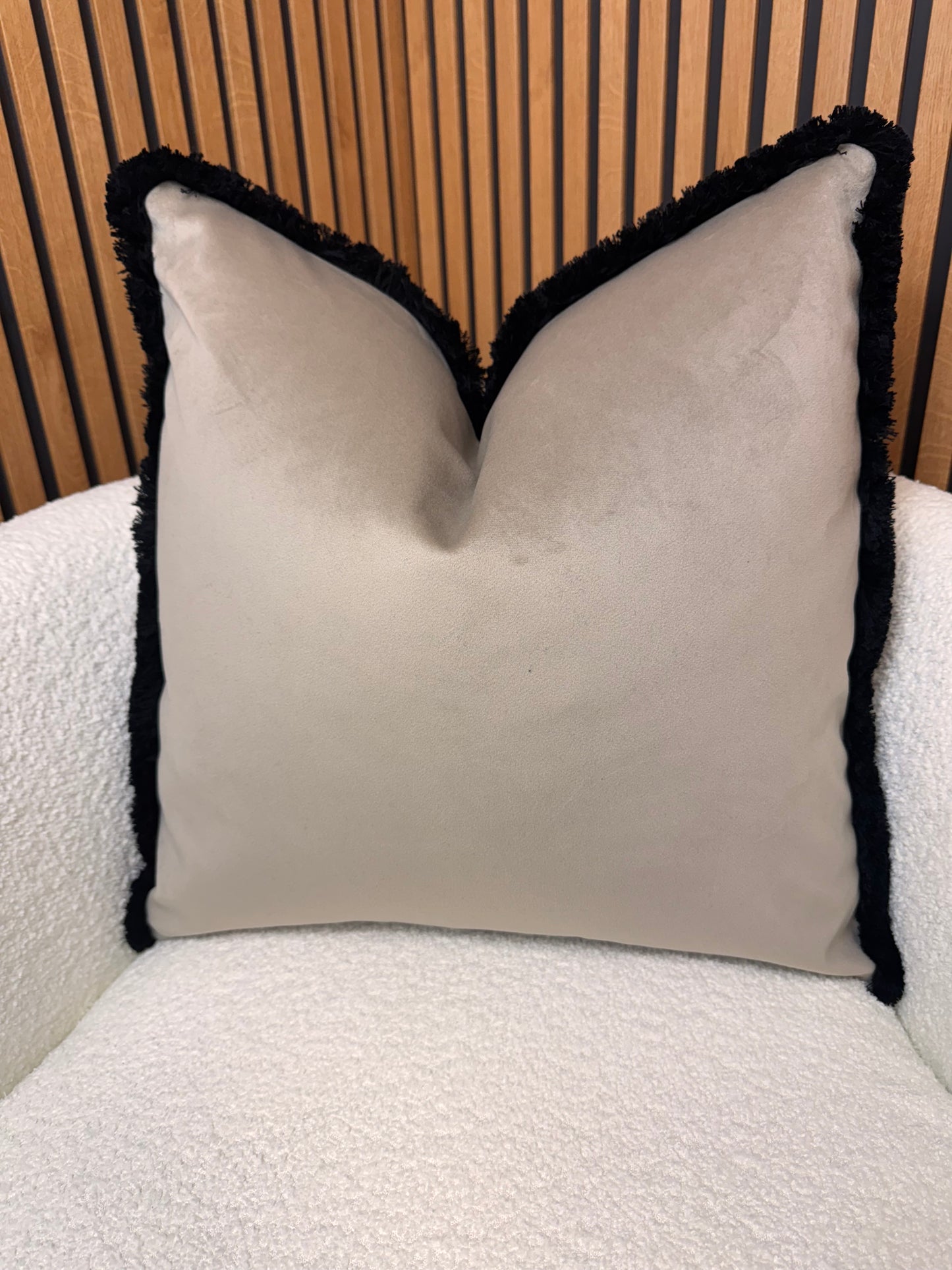 Coffee with black fringe cushion