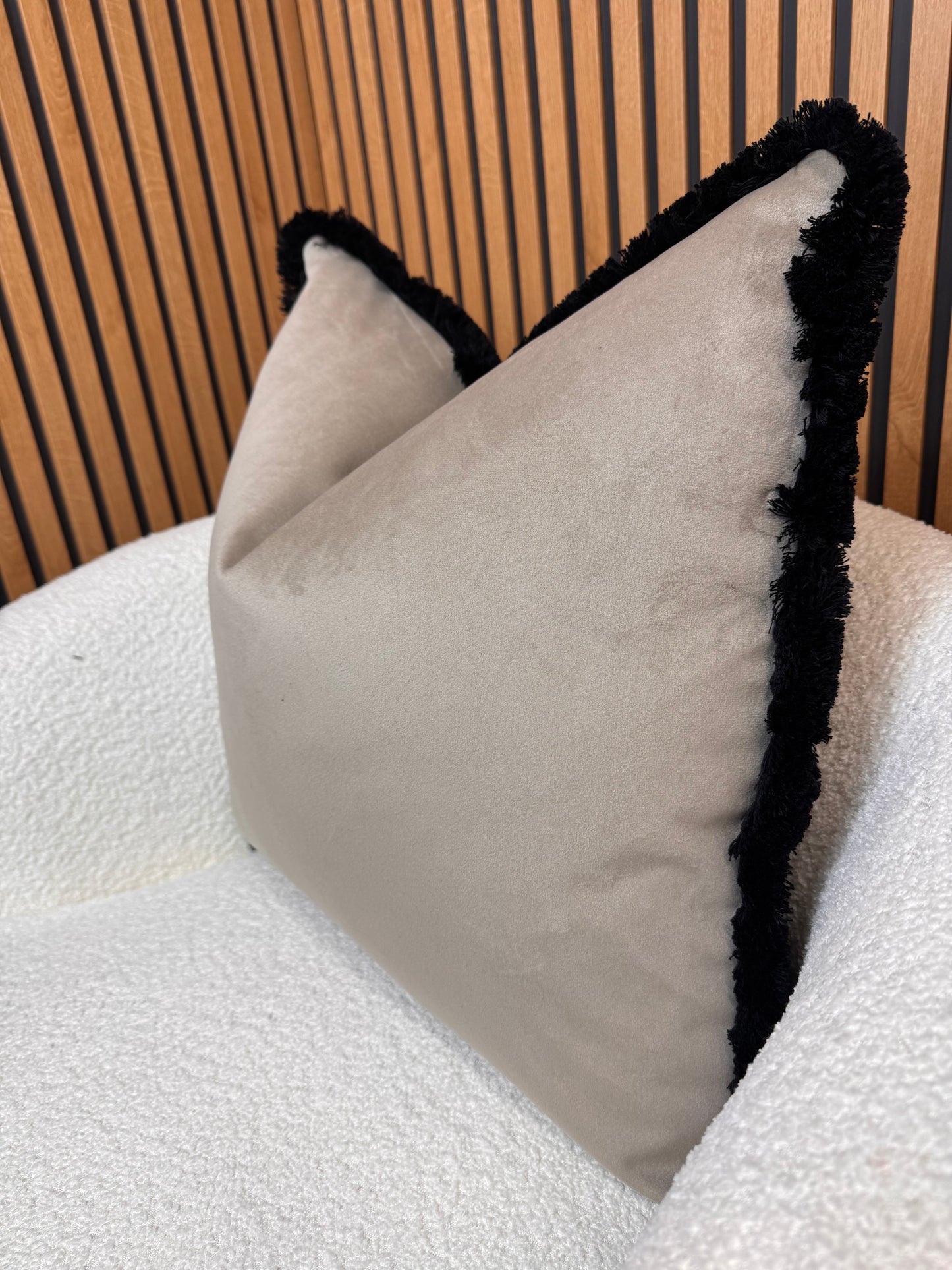 Coffee with black fringe cushion