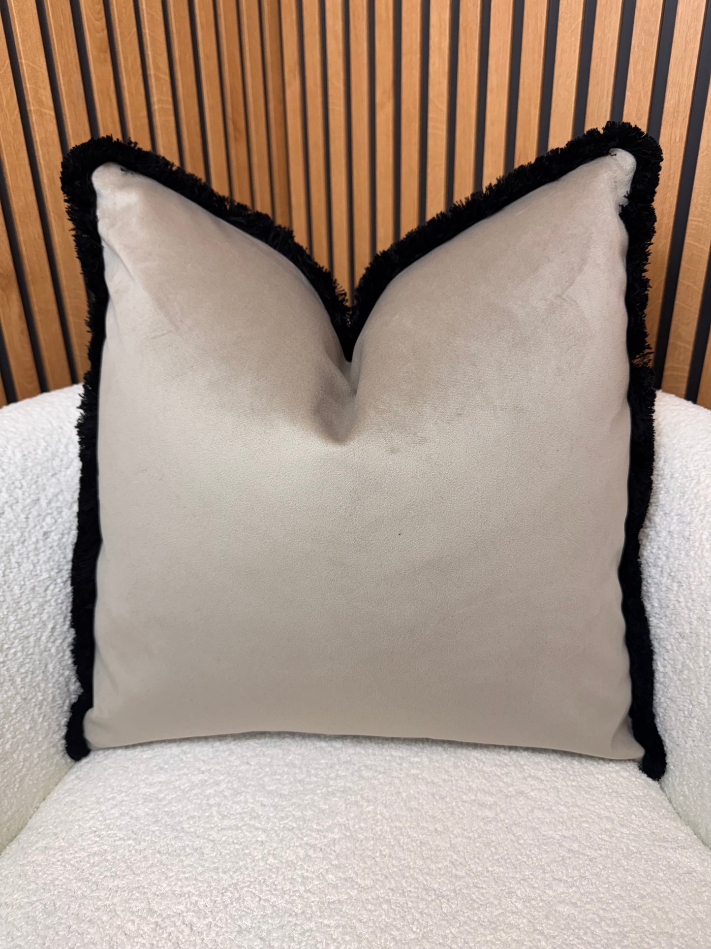 Coffee with black fringe cushion