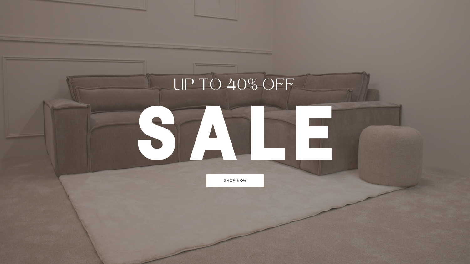Sofa with a 'Sale' banner indicating up to 40% off in a minimalistic room.