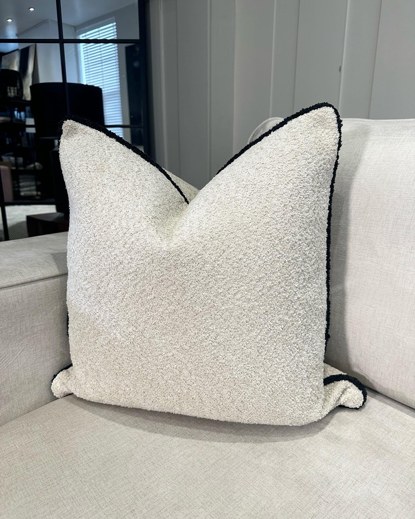 Cream teddy cushion with black piping